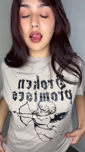 Amateur teen showcases her perky tits in a playful scene