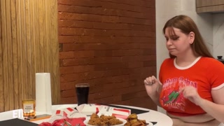 Cute girl overeating KFC. Big Belly Bloat. Painful Stomach