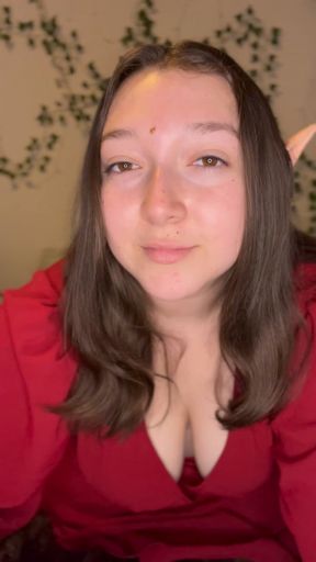 Elf shows off what’s under her red dress