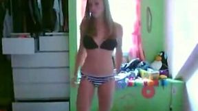 This sexy teen is dancing seductively in front of the webcam