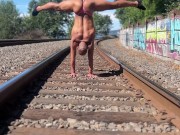 Public Acrobat Handstand in Thong on Train Tracks