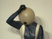 Girl With Transparent Latex Ballhood And Rubber Sheet Makes Breath Play