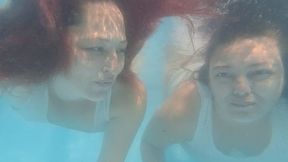 Two girls underwater