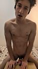 A muscly twink slap his meat and fucks against a table