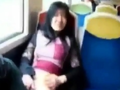 Asian milf rubs her clit on a train.