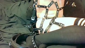 Putting on my bondage harness and cuffs