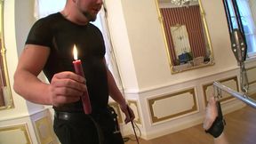 Humiliated woman fucking with a candle