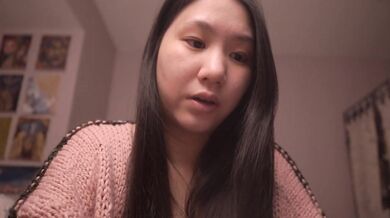 Hot Asian girl whispers Bible verses pillow talk