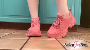 Bailey Jay removes her pink sneakers