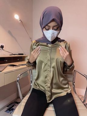 Amateur hijabi girl sits alone and rubs herself