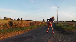 Transgender person ejaculating milk from their rear end outdoors