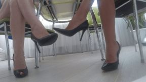 Toe tapping and dangling in sexy black leather shoes sm