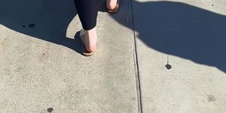 Collegiate chunky broad takes impromptu tit wiggle on public sidewalk stroll