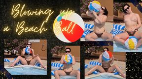 Blowing up inflatable beach ball, poolside in bikini