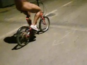 Sexy guy undresses on a public street and rides a bike naked touching his dick - risky