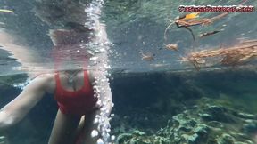 Carissa snorkeling in her Christmas outfit in a spring part 1