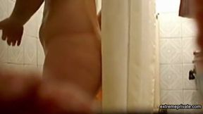 Peeping on Stepmom as she showers (hairy pussy)