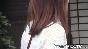 Japanese hottie takes off her dress to piss outside in public