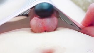 Close up toying with massager on stiffy and jizz on belly
