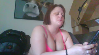 Just a sexy brunette smoking a cig.