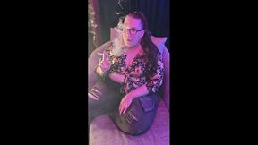 Sitting on my chaise lounge in a pretty flowered top and jeans smoking