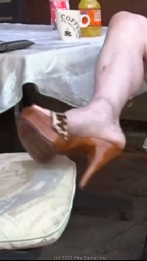 Mrs Samantha's high-heeled wooden mules on display   Clip 3