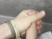 young twink touches his dick in public toilet
