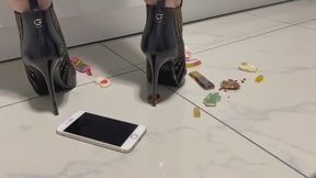 Marina crushes chocolate and candy with her stiletto boots