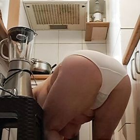 mom cleaning the kitchen on all fours