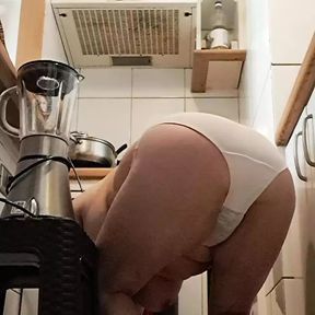 mom cleaning the kitchen on all fours