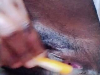 A EBONY BLACK MODEL RUBBING HER PINKY SNATCH WITH A TOOTHBRUSH DURING THE TIME THAT MORNING LOUD