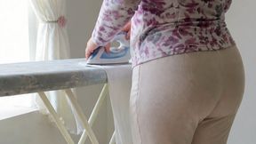 My mature neighbor steps on my hand while ironing