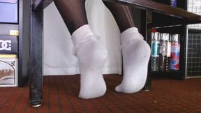 Ruffled Socks Over Black Pantyhose