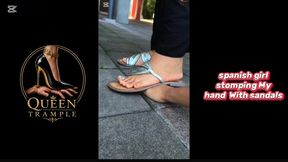 Girl stomping My hand With old sandals