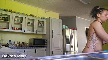 Girlfriend Tidying Up The Kitchen