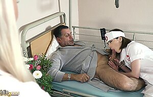 Teen nurses fuck old grandpa in a fake hospital bed and give sloppy blowjob