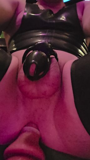 rubber sissy locked in chastity being fucked in the ass by a fuck machine