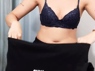 She called a stranger to the fitting room of the store.