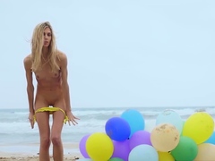 Sexy naked MILF playing with her baloons