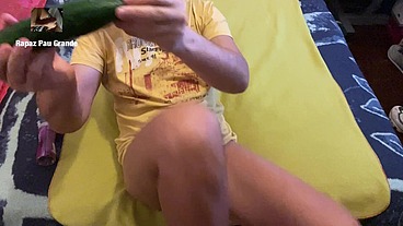 Boy fucks his ass with a toy cucumber.