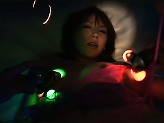 Japanese gal gets played with and fucked by glowing dildos in an awesome scene