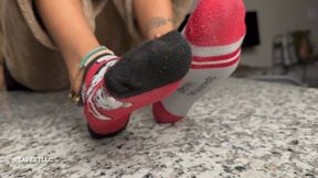“STINKY SOCKS ON GHE KITCHEN COUNTERTOP”