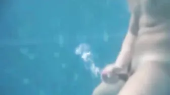 Straight twink jerks off underwater and cums in public pool