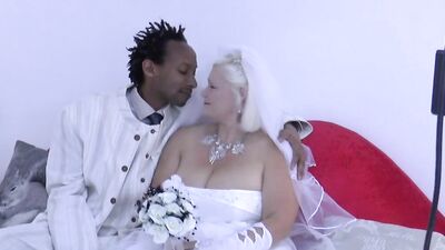 Curvy mature woman sucks a black cock and gets drilled with it
