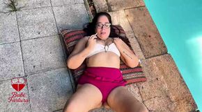 Relaxing, smoking and playing one by the pool with the construction workers on the side watching