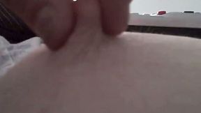 Playing with the pink sensitive nipple of my girlfriend