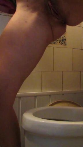 I pee in the toilet and stuff my thong into my cunt   Clip 1