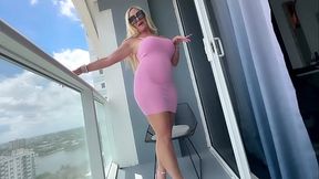 MILF shows off her big tits and curvy ass in pink dress