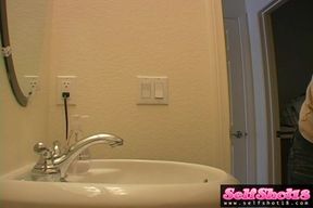 Watch this kinky teen amateur put on a show in the bathroom