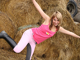 Cora plays with herself in the haystack